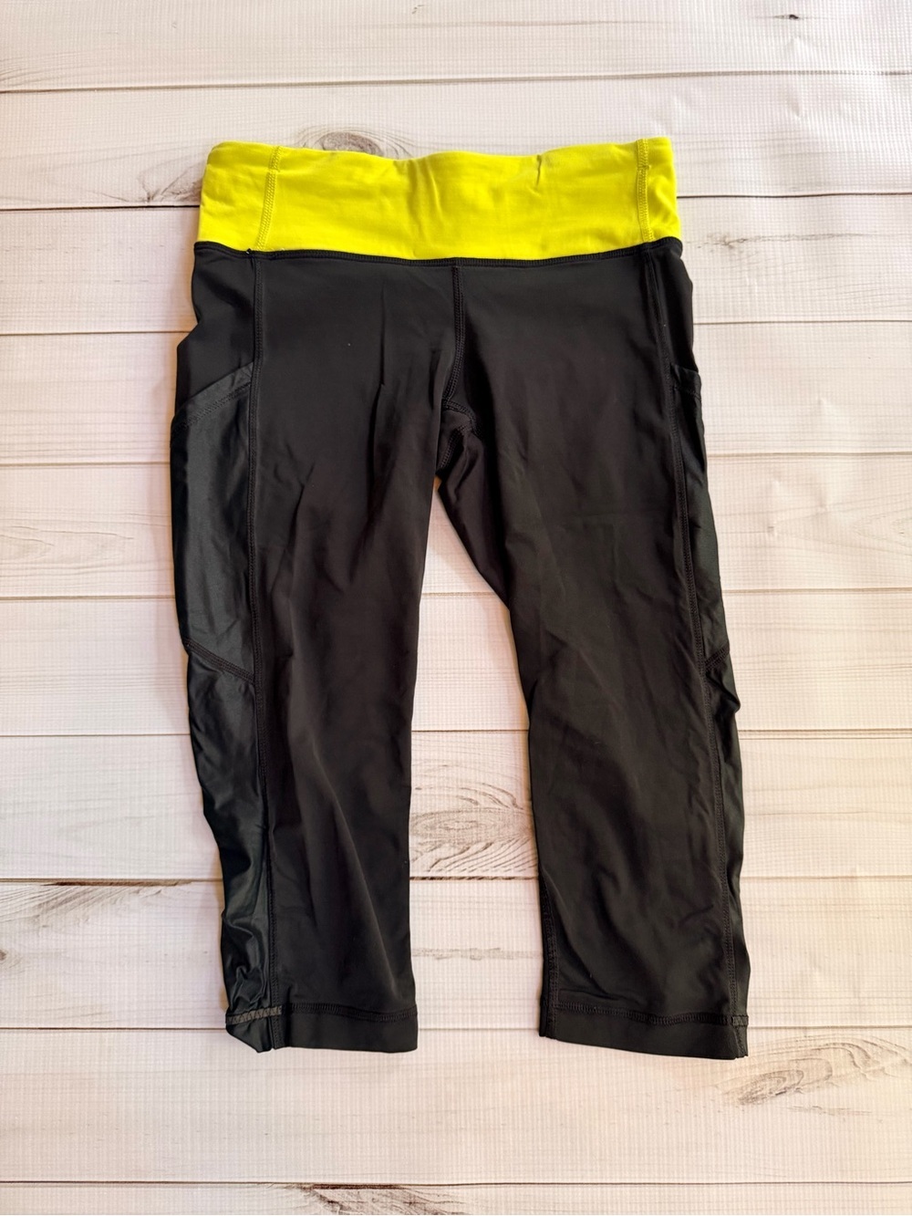 lululemon athletica Black Capri Leggings with Bright Yellow Waistband